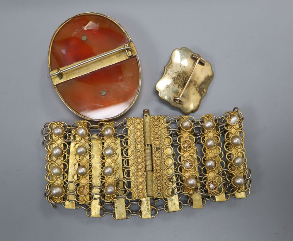 A 19th century composition cameo portrait on a carnelian plaque, in gilt metal mount and three other items,